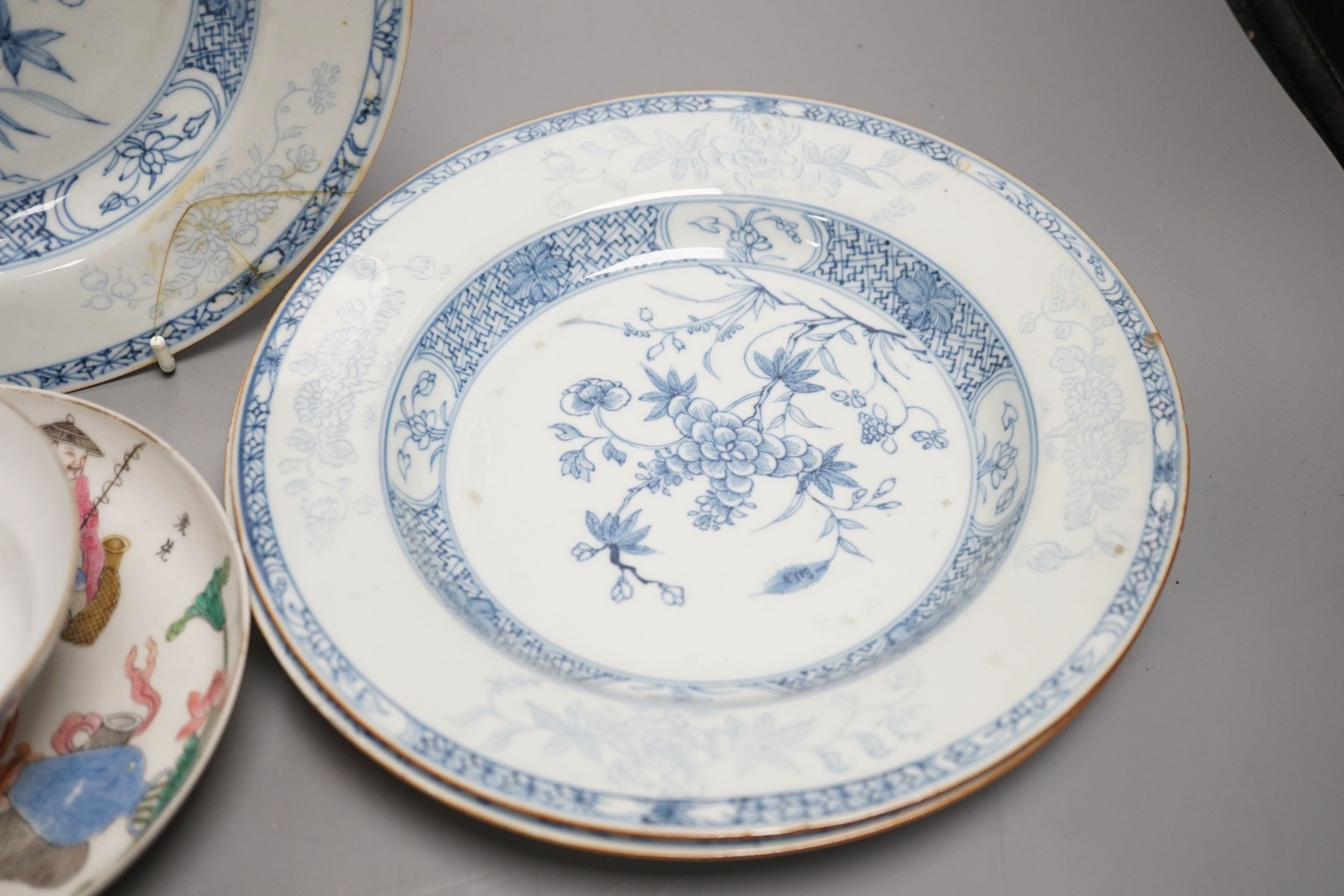 A 19th century Chinese famille rose bowl and saucer, a blue and white tea bowl on stand, a hardstone carving and three 18th century blue and white plates